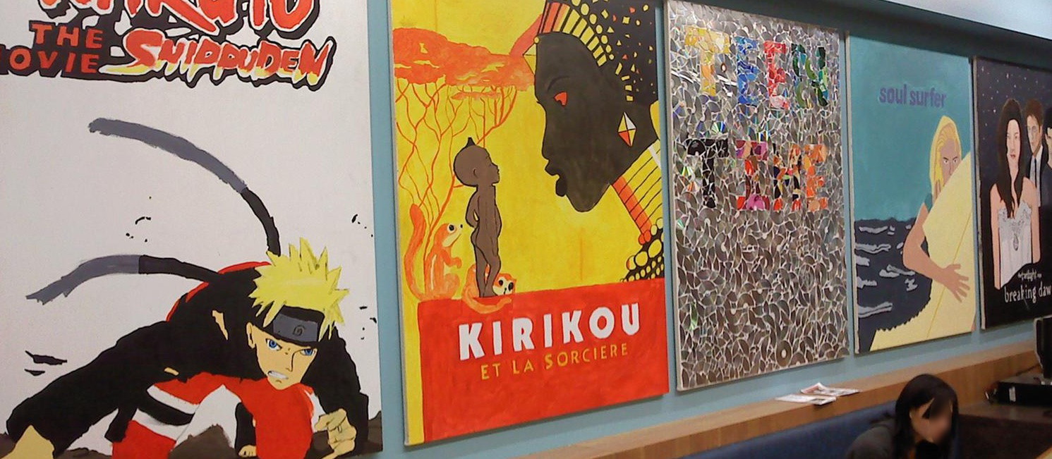 Picture of 5 movie covers painted on 5ft x4ft art boards by teens in south Madison