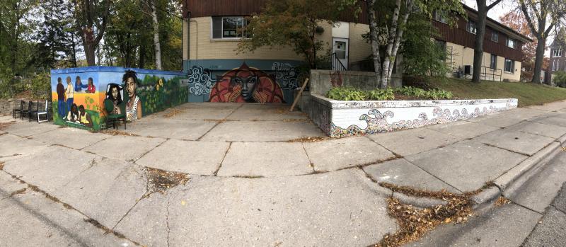 View of 3 different murals by 5 different artists that surround the Shelter Home driveway