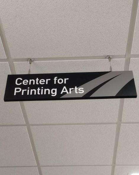 Sign hanging in Madison College for Center of Printing Arts