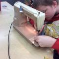Bubbler Teen using sewing machine 