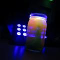 picture of black light reacting with jar of chemicals