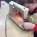 Bubbler Teen using sewing machine 