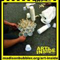 picture of teen creating art piece using plastic juice cups and clothespins